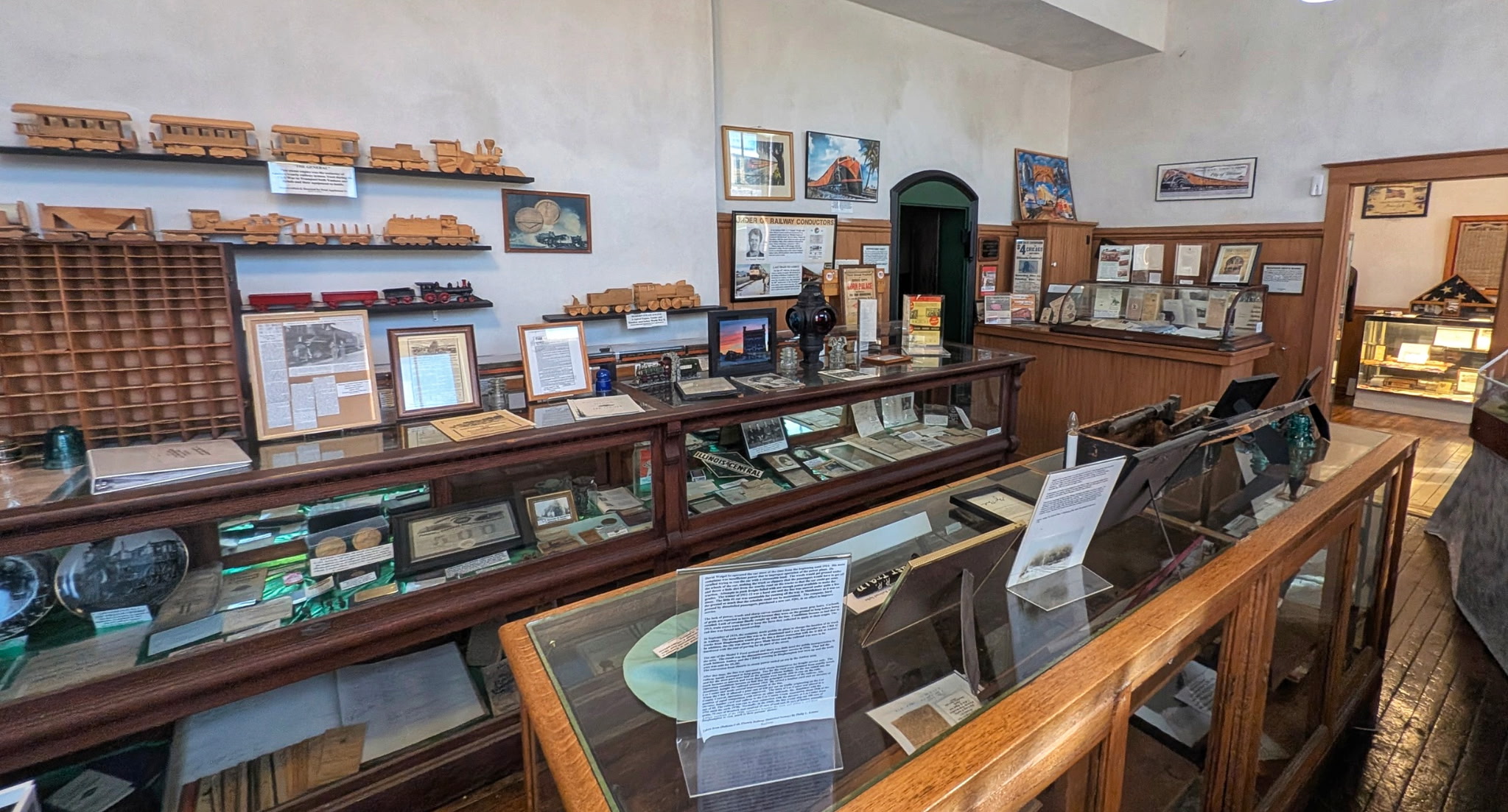 Railroad artifacts displayed in glass cases inside the Amboy Depot Museum